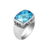 Sterling silver ring with a sparkling cushion-cut blue topaz  Quartz and delicate Balinese scroll details, handcrafted for a bold and elegant look.